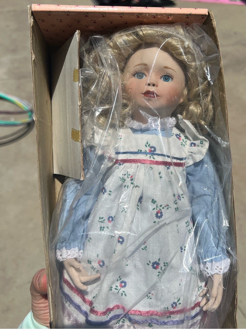 Paradise Galleries Amanda Porcelain Doll with Blue Dress and Floral Apron NIB